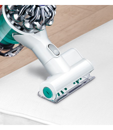 Agitates and removes dust from upholstery.